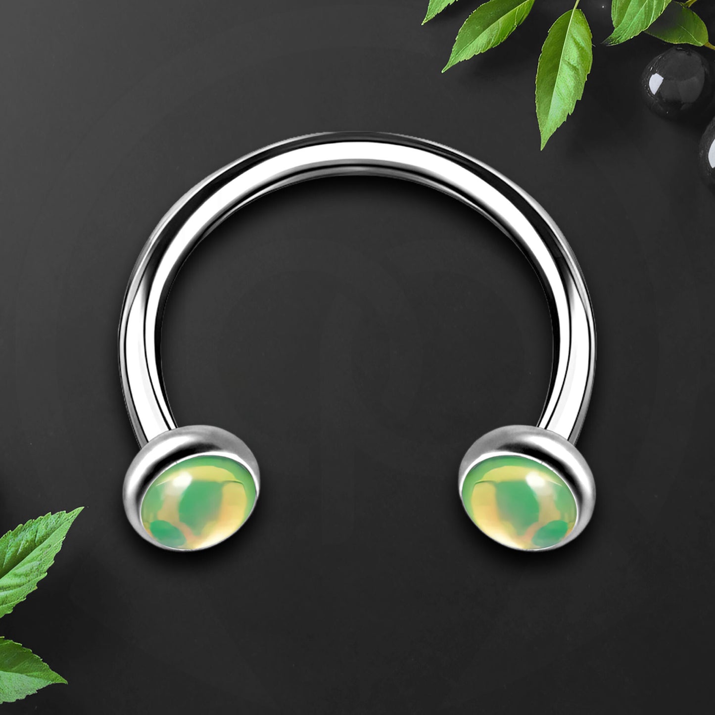 Titanium Horseshoe Ring with Green Glow Gemstone