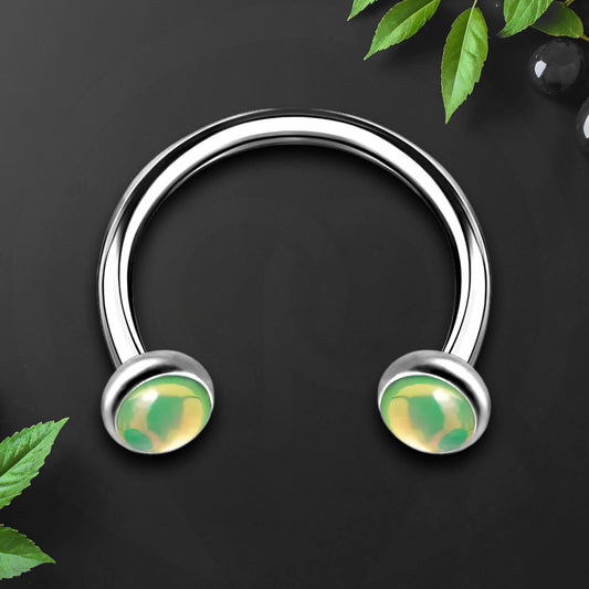 Titanium Horseshoe Ring with Green Glow Gemstone