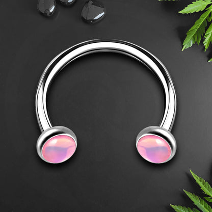 Titanium Horseshoe Ring with Pink Glow Gemstone