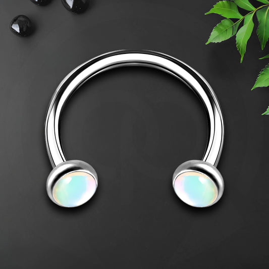 Titanium Horseshoe Ring with White Glow Gemstone